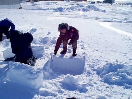 Alex T. cutting one of the first blocks for the igloo.